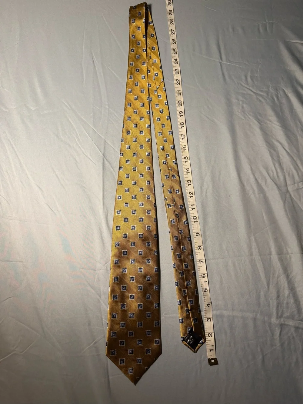 Jos. A. Bank Gold Tie with Navy Geometric Medallions